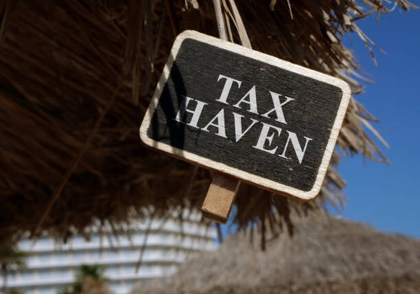 Tax haven sign on wooden plate.